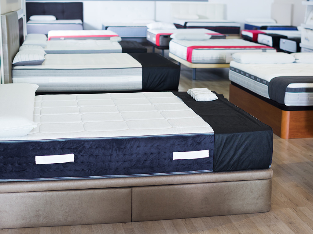 Mattresses on display in a showroom.
