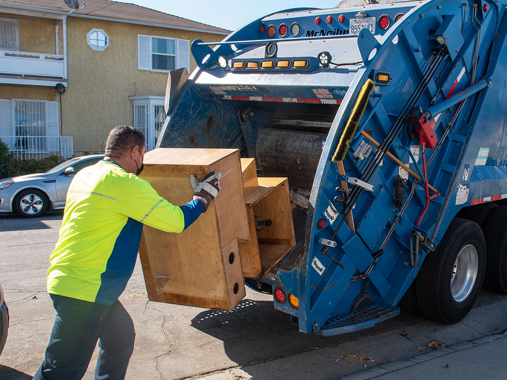 Waste hauler performing a bulky item pickup in Unincorporated Los Angeles County.