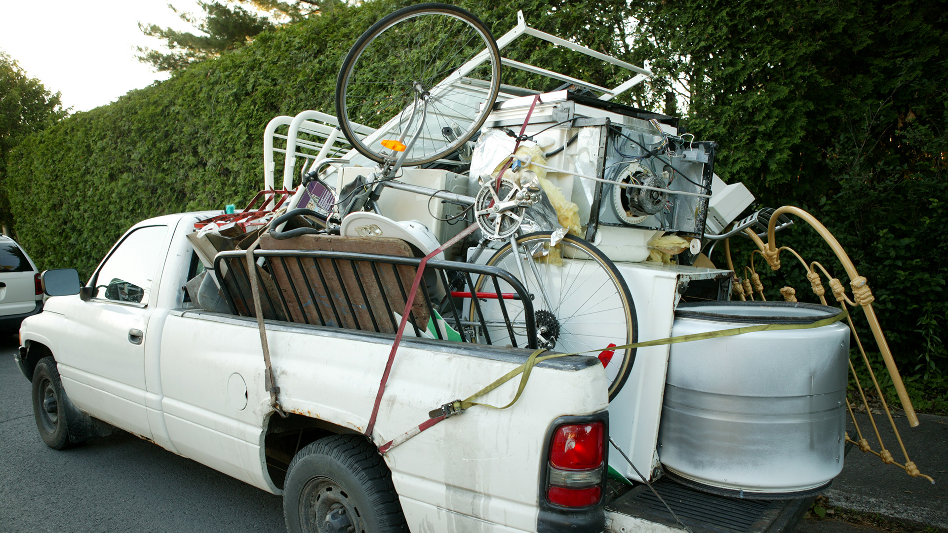 Pickup truck loaded with items to be disposed of at a landfill